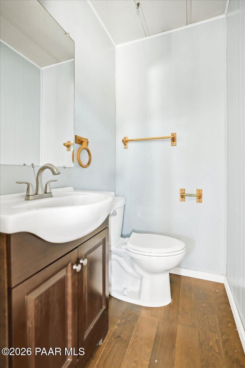 192 North Outback Road Dewey, AZ 86327 - Photo 11 of 25 a bathroom with a sink a toilet and a mirror
