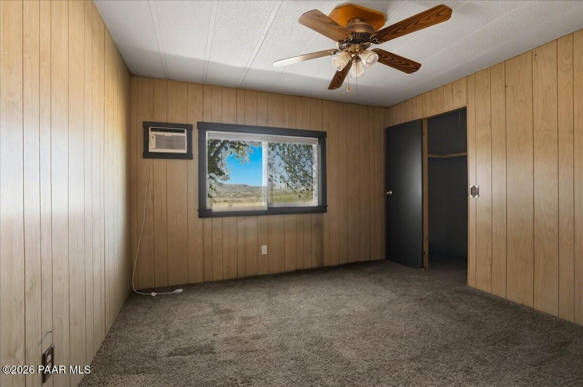 192 North Outback Road Dewey, AZ 86327 - Photo 14 of 25 an empty room with windows and fan