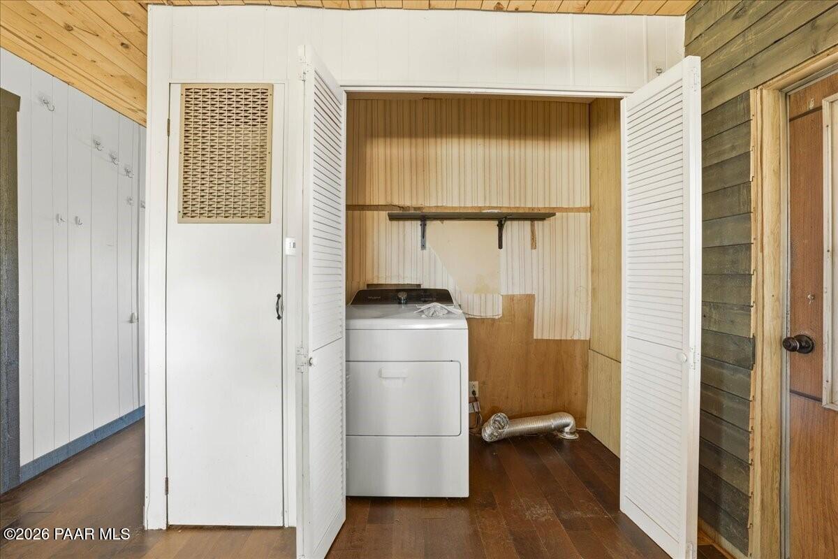 192 North Outback Road Dewey, AZ 86327 - Photo 15 of 25 a view of a hallway with wooden floor and a refrigerator