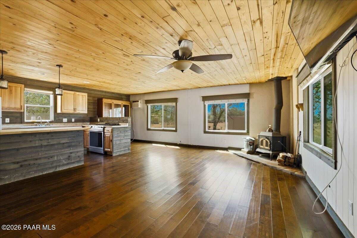 192 North Outback Road Dewey, AZ 86327 - Photo 5 of 25 a view of a living room hardwood and kitchen with furniture wooden floor and windows