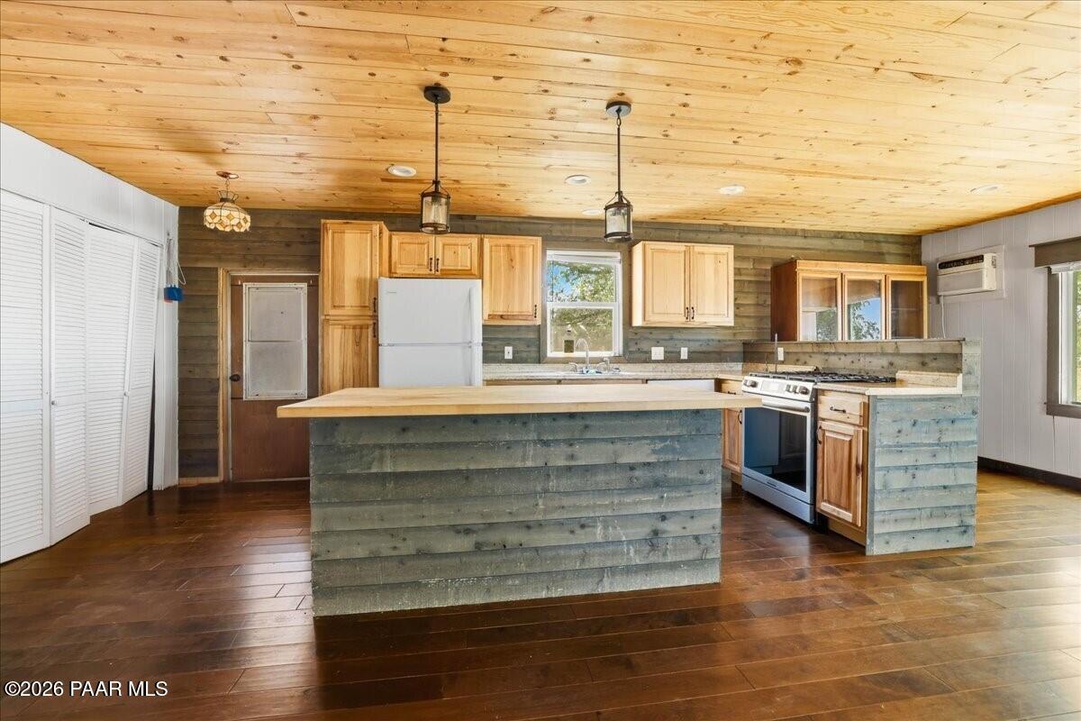 192 North Outback Road Dewey, AZ 86327 - Photo 6 of 25 a large kitchen with stainless steel appliances granite countertop a stove and a refrigerator