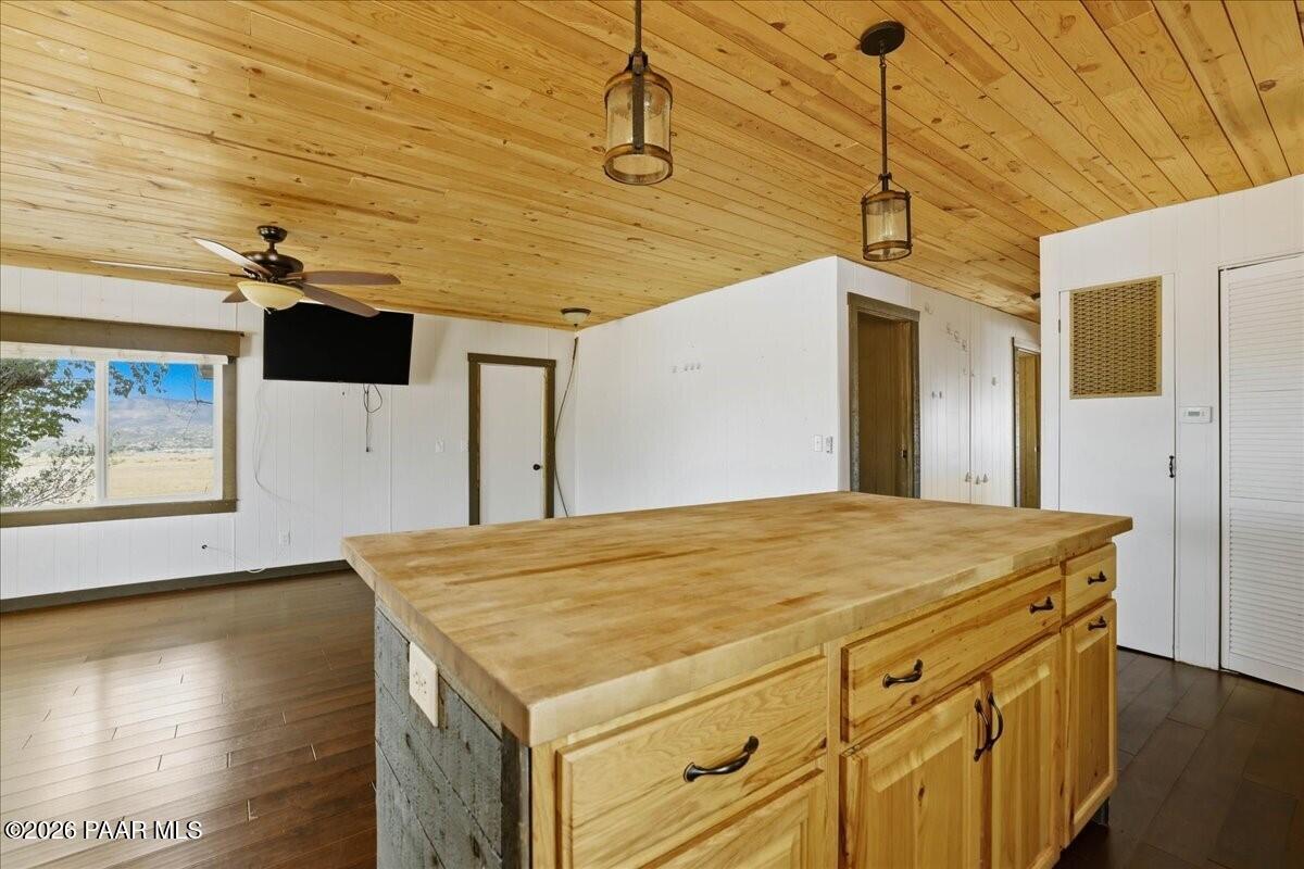 192 North Outback Road Dewey, AZ 86327 - Photo 8 of 25 a kitchen with a stove and a wooden floor