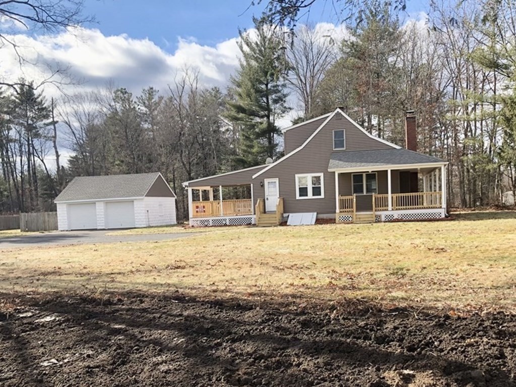 945 Tinkham Road Wilbraham, MA 01095 - Photo 1 of 26 a front view of a house with a garden