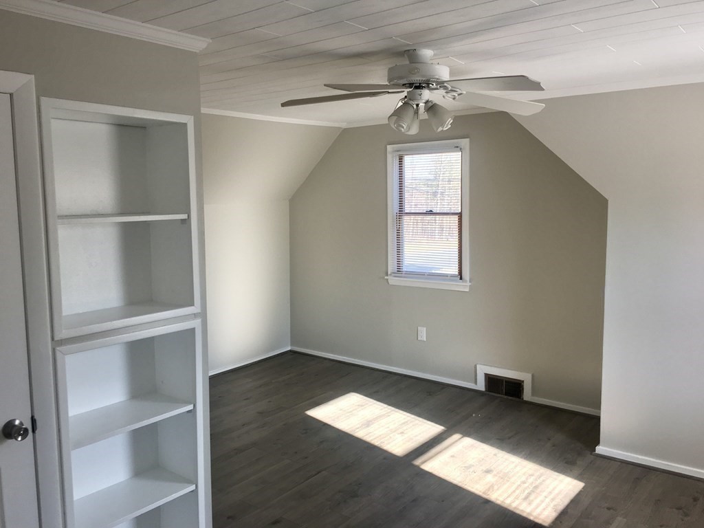 945 Tinkham Road Wilbraham, MA 01095 - Photo 13 of 26 a view of empty room with wooden floor and fan