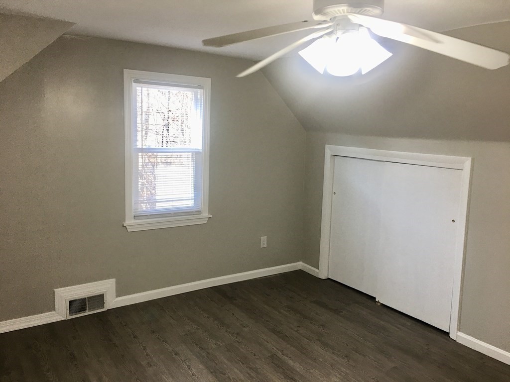 945 Tinkham Road Wilbraham, MA 01095 - Photo 15 of 26 an empty room with wooden floor and window