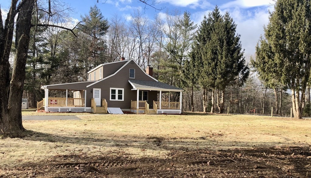 945 Tinkham Road Wilbraham, MA 01095 - Photo 18 of 26 a front view of a house with a yard covered with snow