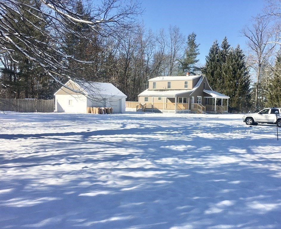945 Tinkham Road Wilbraham, MA 01095 - Photo 24 of 26 a front view of a house with a yard