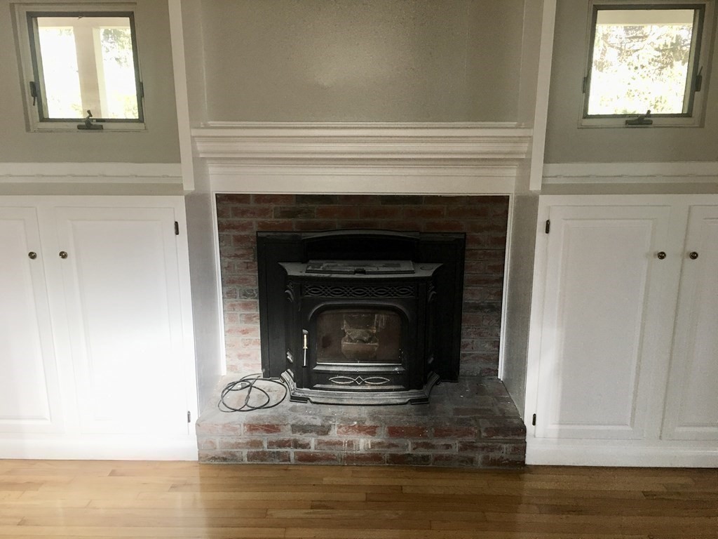 945 Tinkham Road Wilbraham, MA 01095 - Photo 9 of 26 a living room with a fireplace