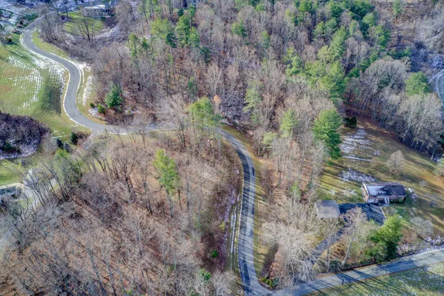 a aerial view of a house with a yard