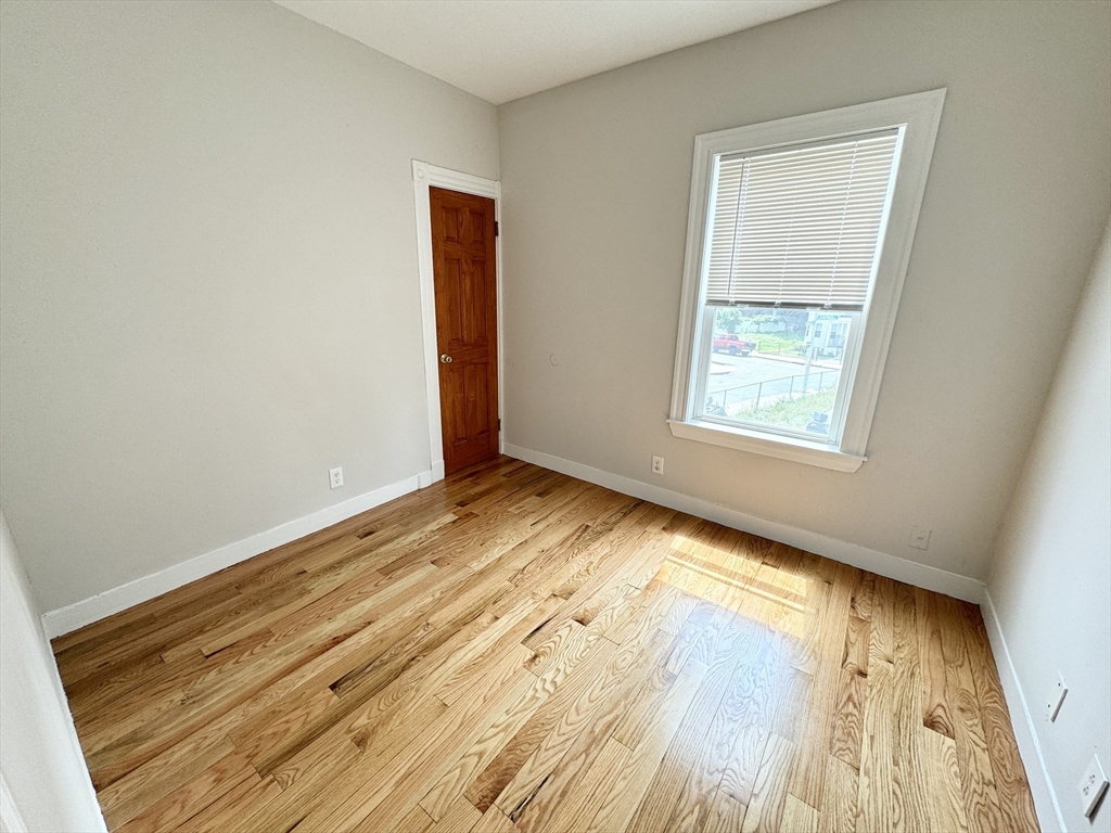 6 Cawfield Street, Unit 2 Boston, MA 02125 - Photo 5 of 8 a view of an empty room and window