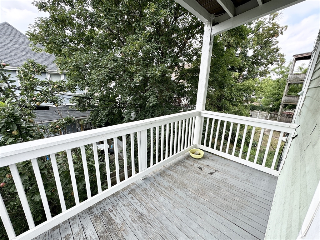 6 Cawfield Street, Unit 2 Boston, MA 02125 - Photo 8 of 8 a view of balcony with wooden floor