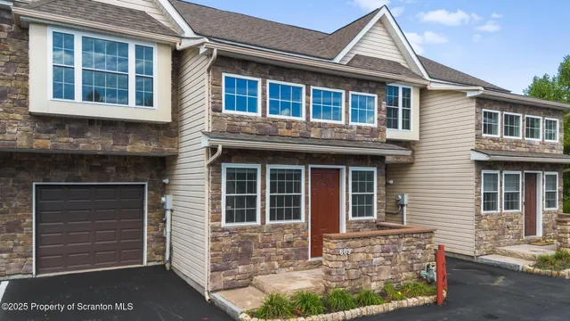 a front view of a house with glass windows