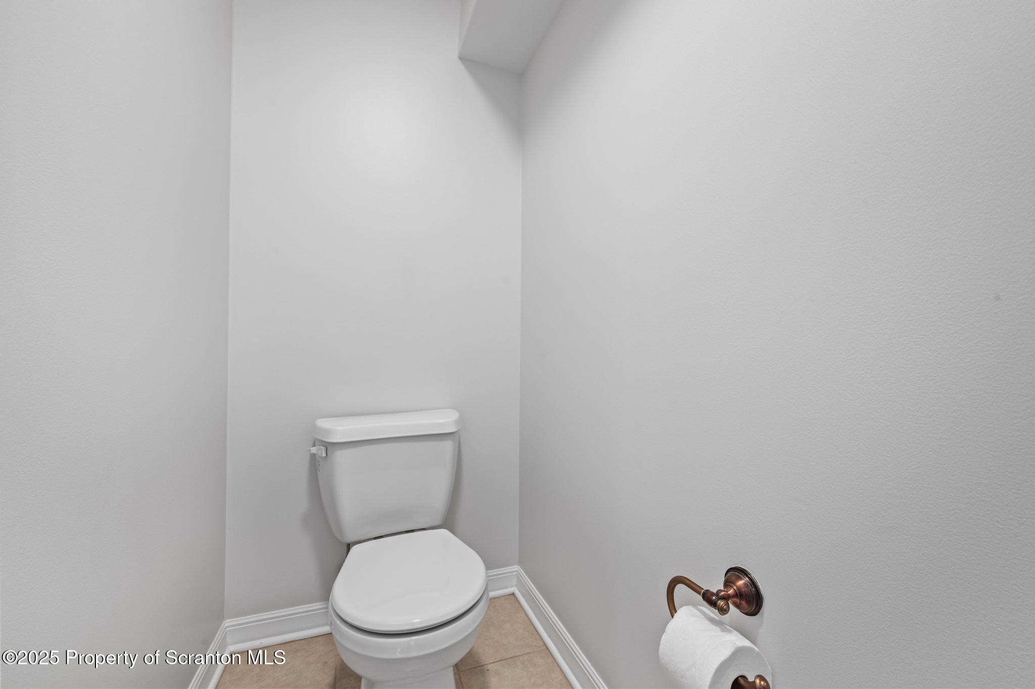 609 Edith Street Old Forge, PA 18518 - Photo 12 of 25 a white toilet sitting next to a white wall