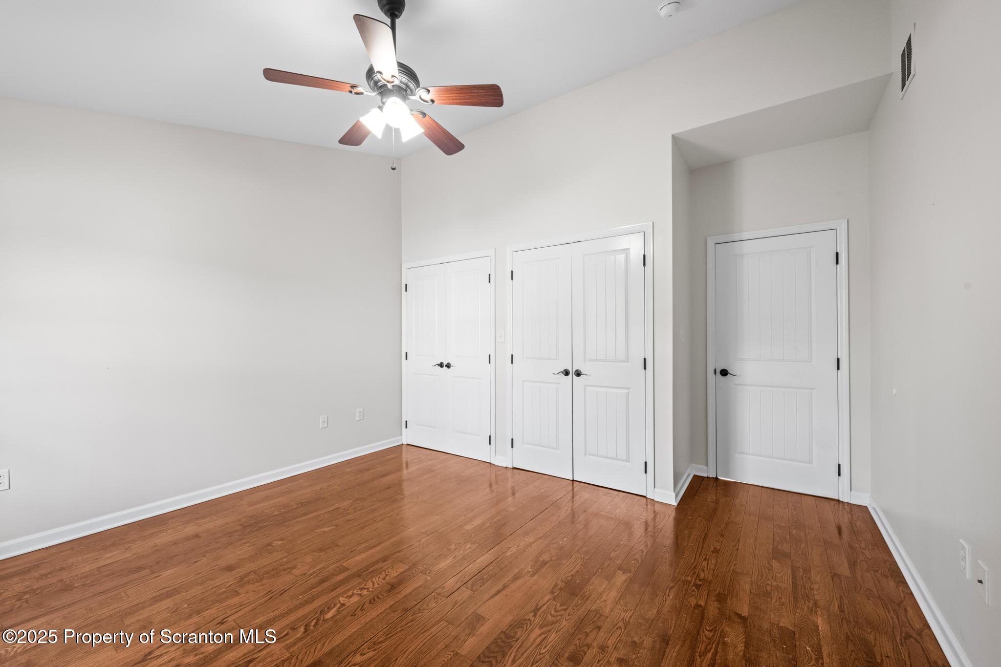 609 Edith Street Old Forge, PA 18518 - Photo 8 of 25 a view of room with hardwood floor and ceiling fan