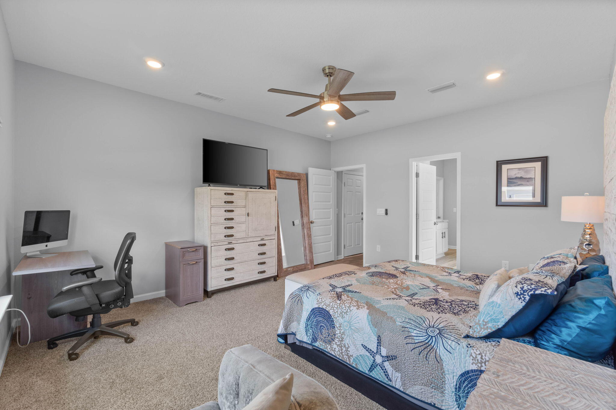 38 Silverthorn Street Freeport, FL 32439 - Photo 19 of 42 a bedroom with a bed and a flat screen tv