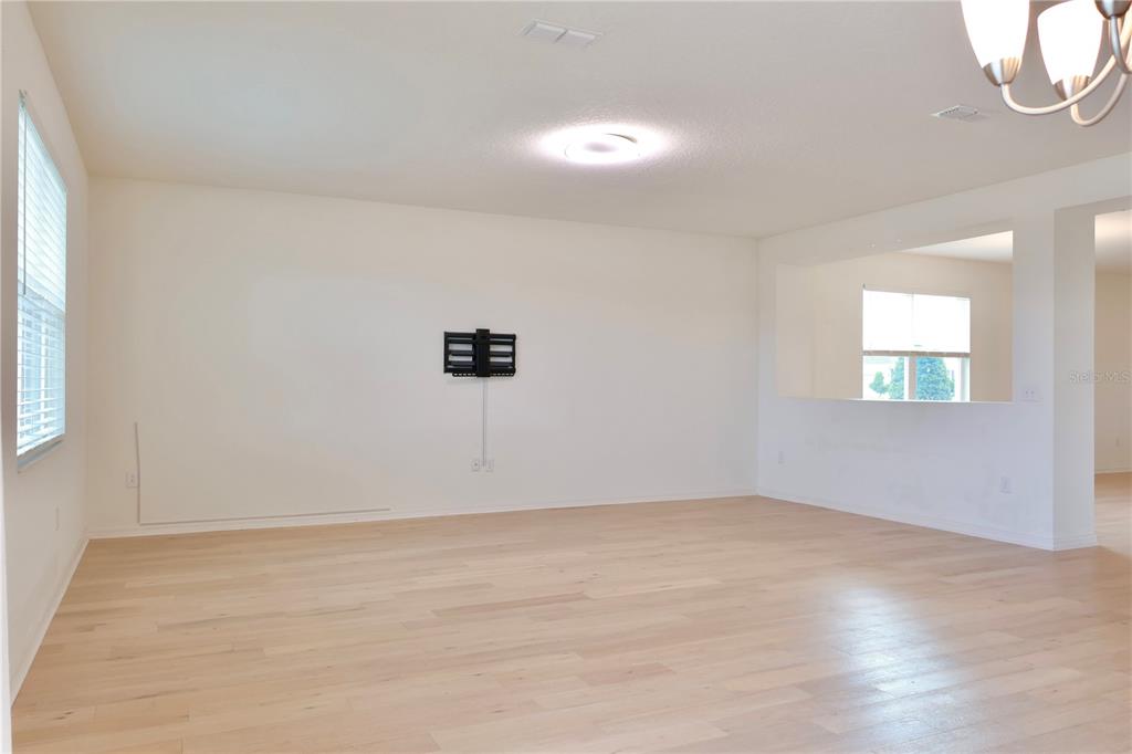 2164 Carriage Pointe Loop Apopka, FL 32712 - Photo 13 of 30 a view of an empty room with a window