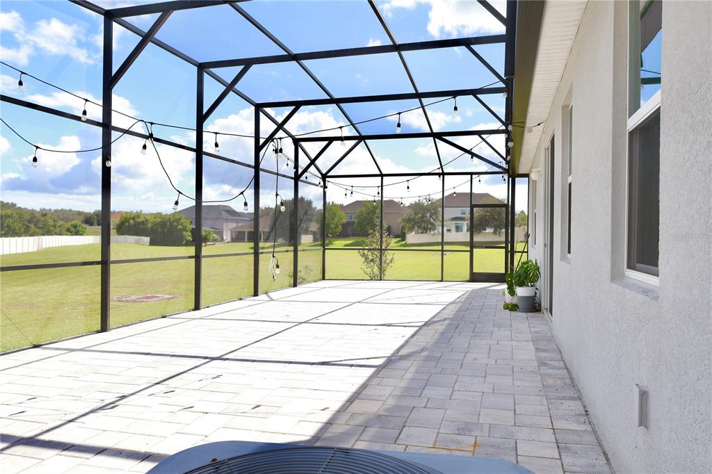 2164 Carriage Pointe Loop Apopka, FL 32712 - Photo 29 of 30 a view of an empty room with a floor to ceiling windows
