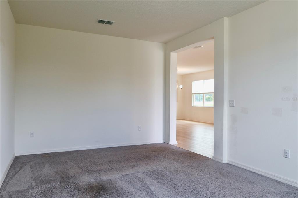 2164 Carriage Pointe Loop Apopka, FL 32712 - Photo 6 of 30 a view of an empty room and a window
