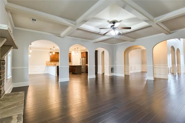 a view of livingroom with wooden floor and fan