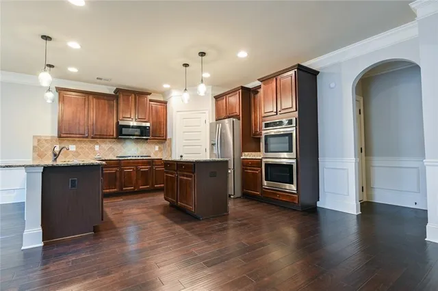 a view of wooden floor and windows in a room