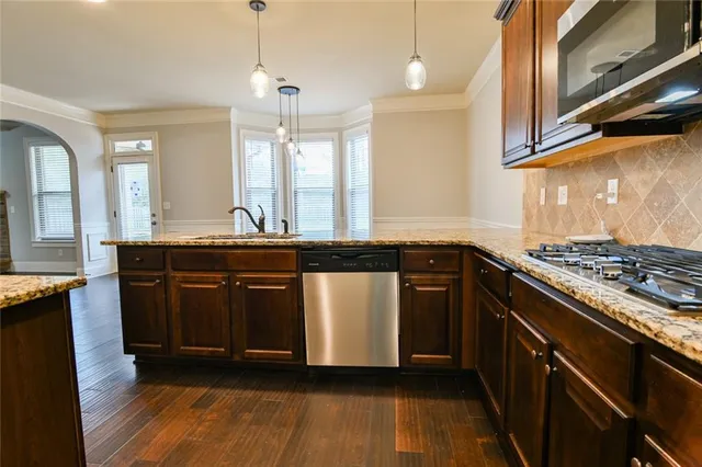 a view of staircase with railing and a painting