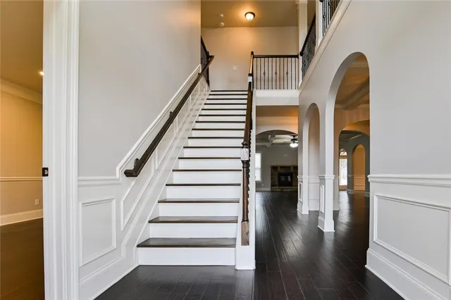 a view of entryway and hall with wooden floor