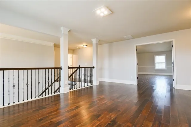 wooden floor with white walls