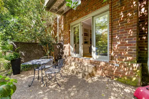 a backyard of a house with outdoor seating