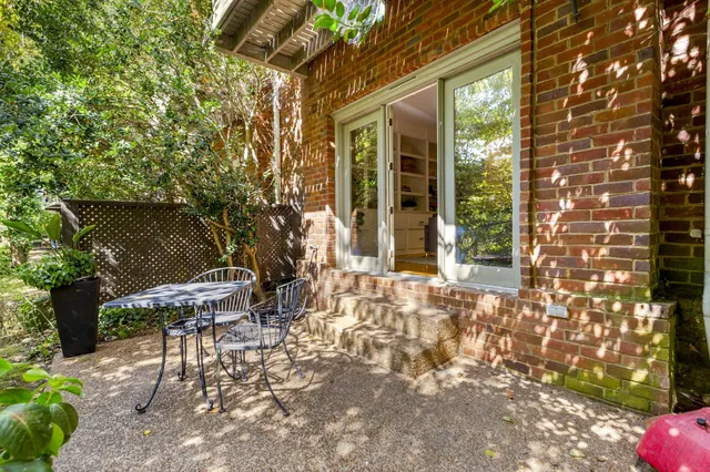 a backyard of a house with outdoor seating