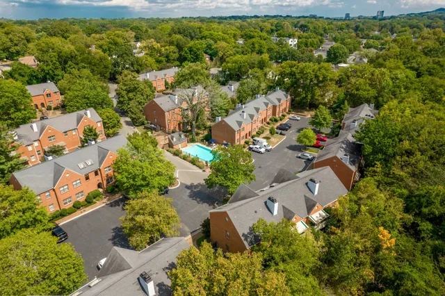 an aerial view of house with yard swimming pool and outdoor seating