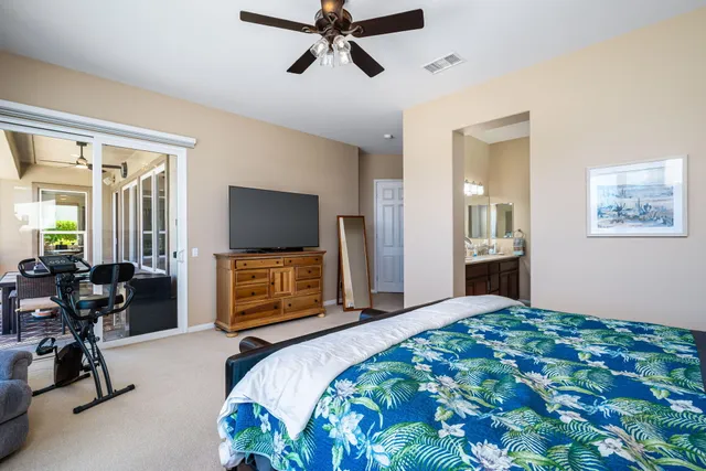 a view of a house with swimming pool and sitting area