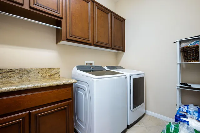 a view of a chairs and table in the balcony