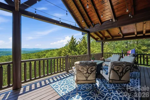 a view of balcony with furniture