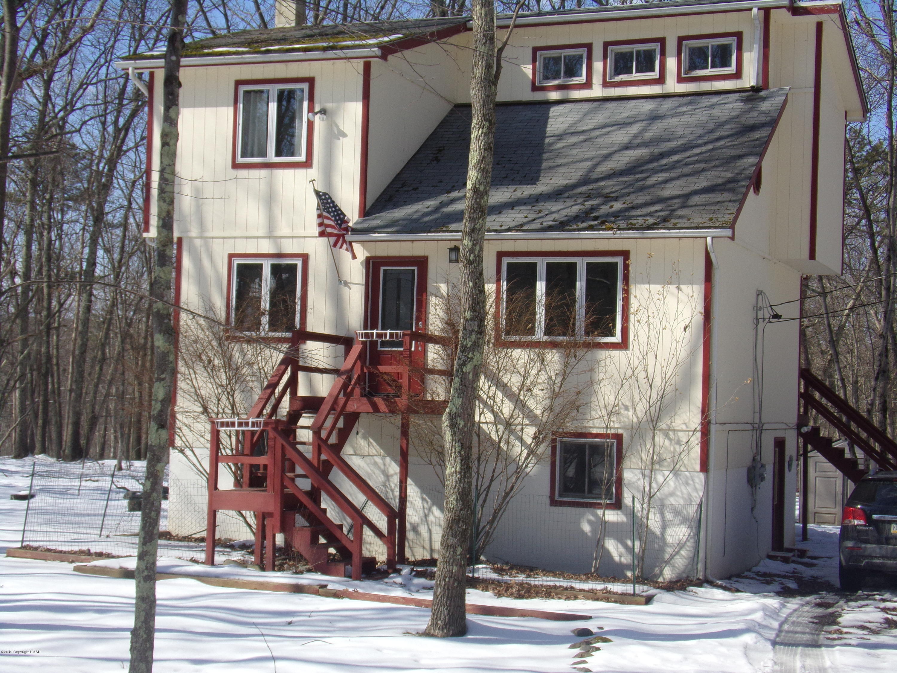 1193 Bear Drive Bushkill, PA 18324 - Photo 1 of 29 a front view of a house with a tree