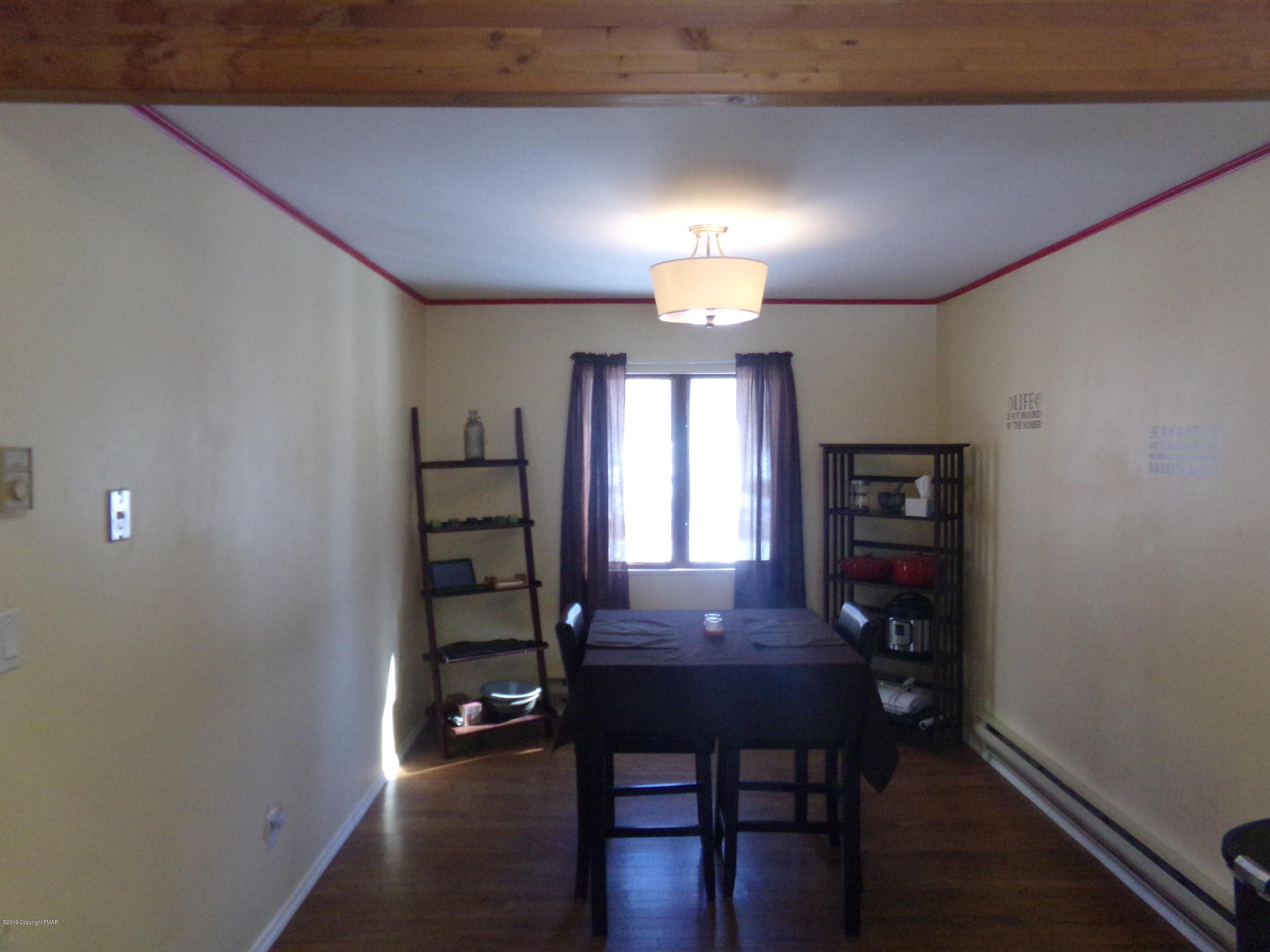 1193 Bear Drive Bushkill, PA 18324 - Photo 11 of 29 a view of a livingroom with furniture and wooden floor