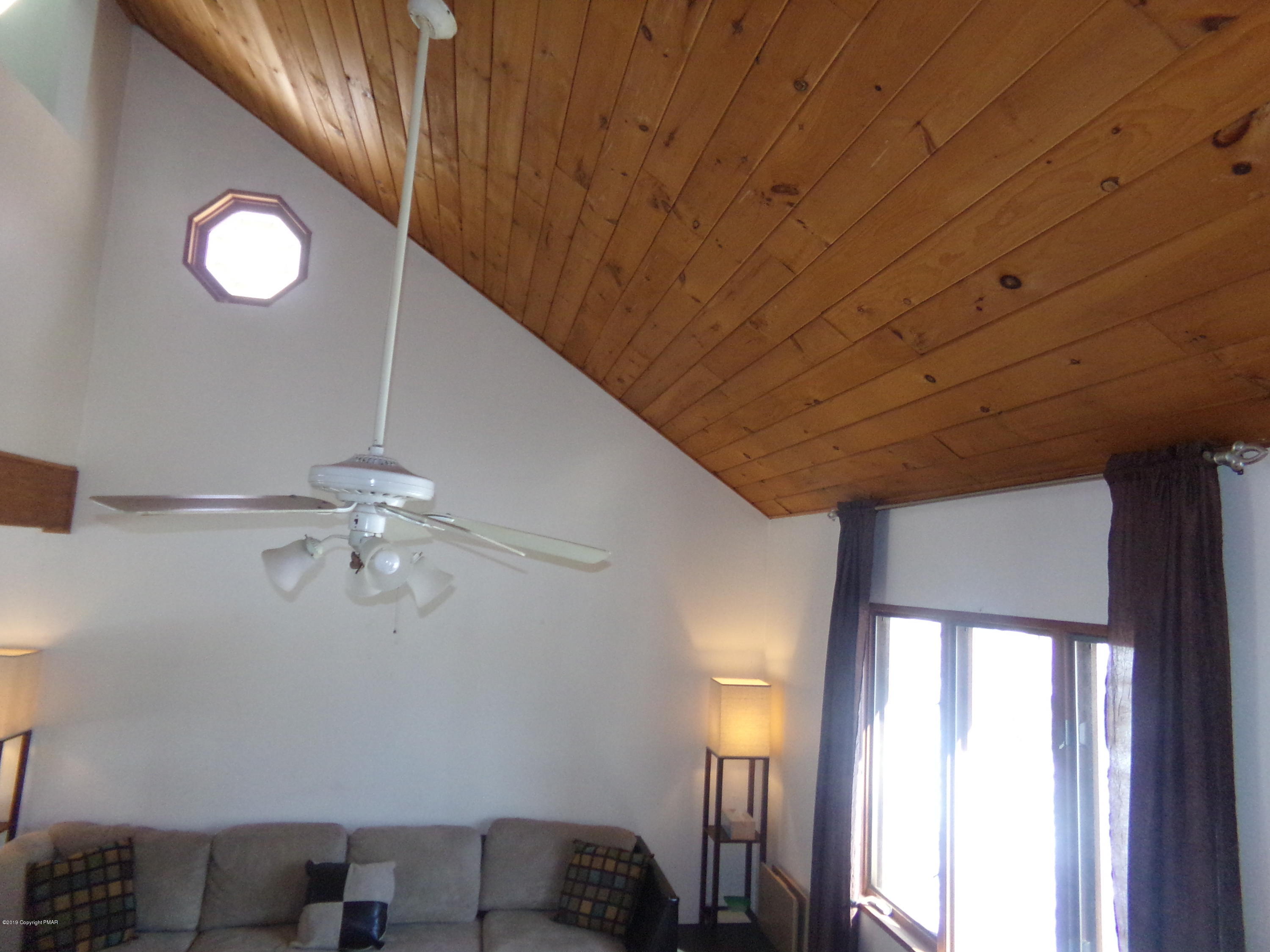 1193 Bear Drive Bushkill, PA 18324 - Photo 14 of 29 a view of livingroom with furniture and chandelier fan