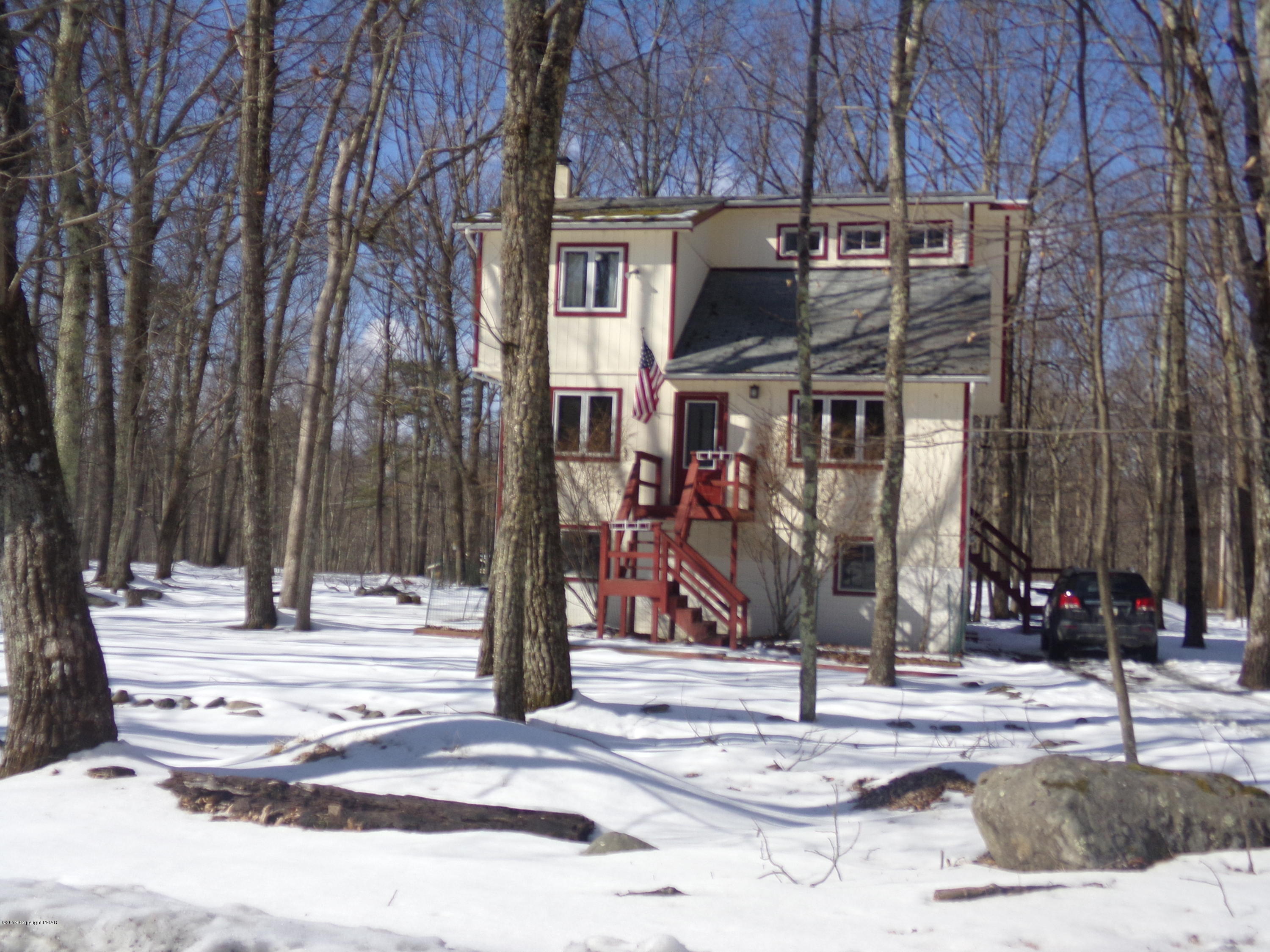 1193 Bear Drive Bushkill, PA 18324 - Photo 2 of 29 a view of road with a building and trees in the background