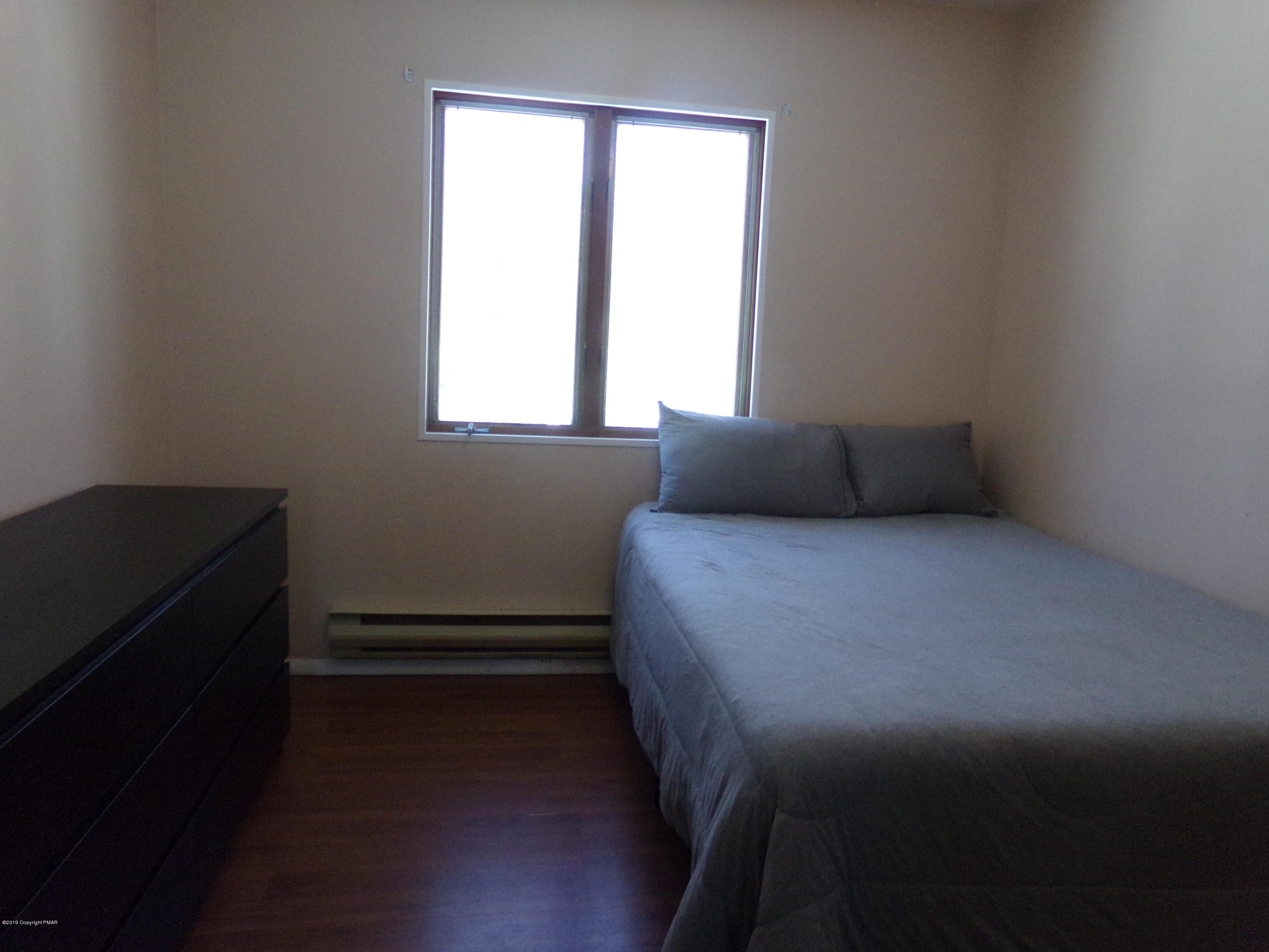 1193 Bear Drive Bushkill, PA 18324 - Photo 21 of 29 a bedroom with a bed and a window