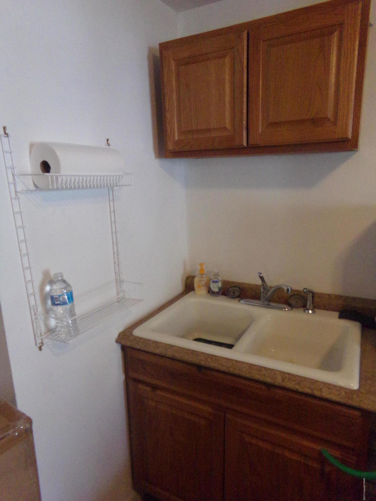 1193 Bear Drive Bushkill, PA 18324 - Photo 29 of 29 a bathroom with a sink and cabinets