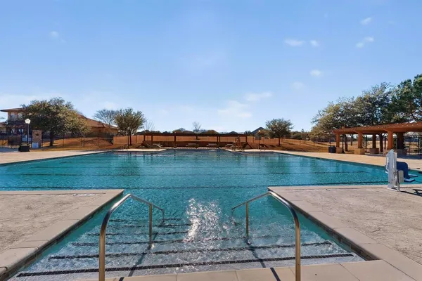 a view of swimming pool with a yard