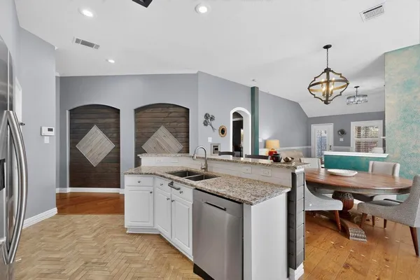 a view of living room with granite countertop furniture and floor to ceiling window