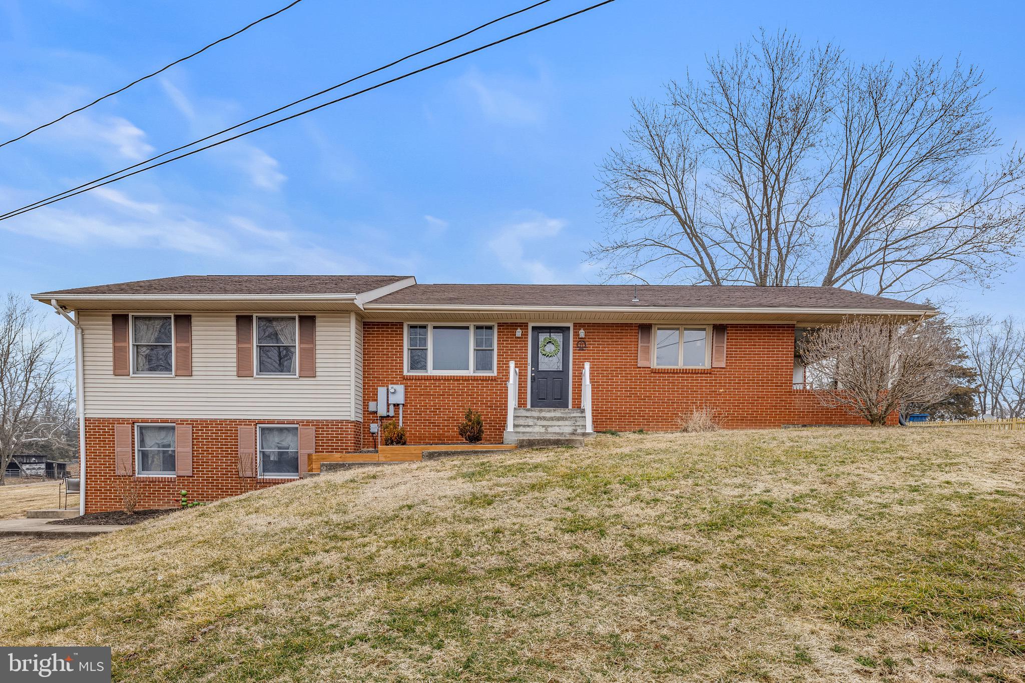 3360 Senedo Road Quicksburg, VA 22847 - Photo 1 of 58 a front view of house with yard and trees in the background