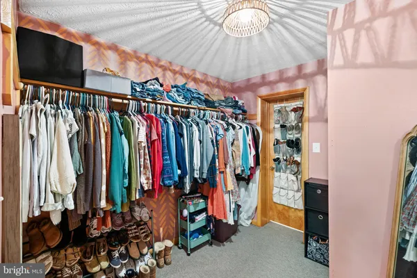 a bedroom with a bed and flat screen tv