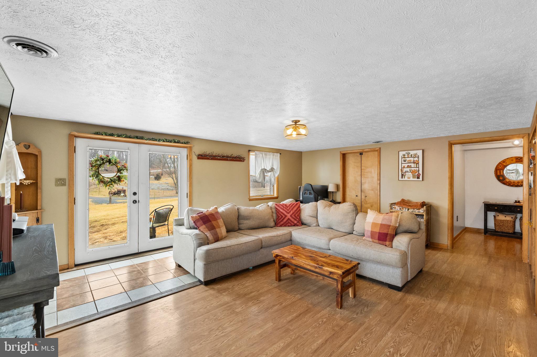 3360 Senedo Road Quicksburg, VA 22847 - Photo 30 of 58 a living room with furniture and a large window