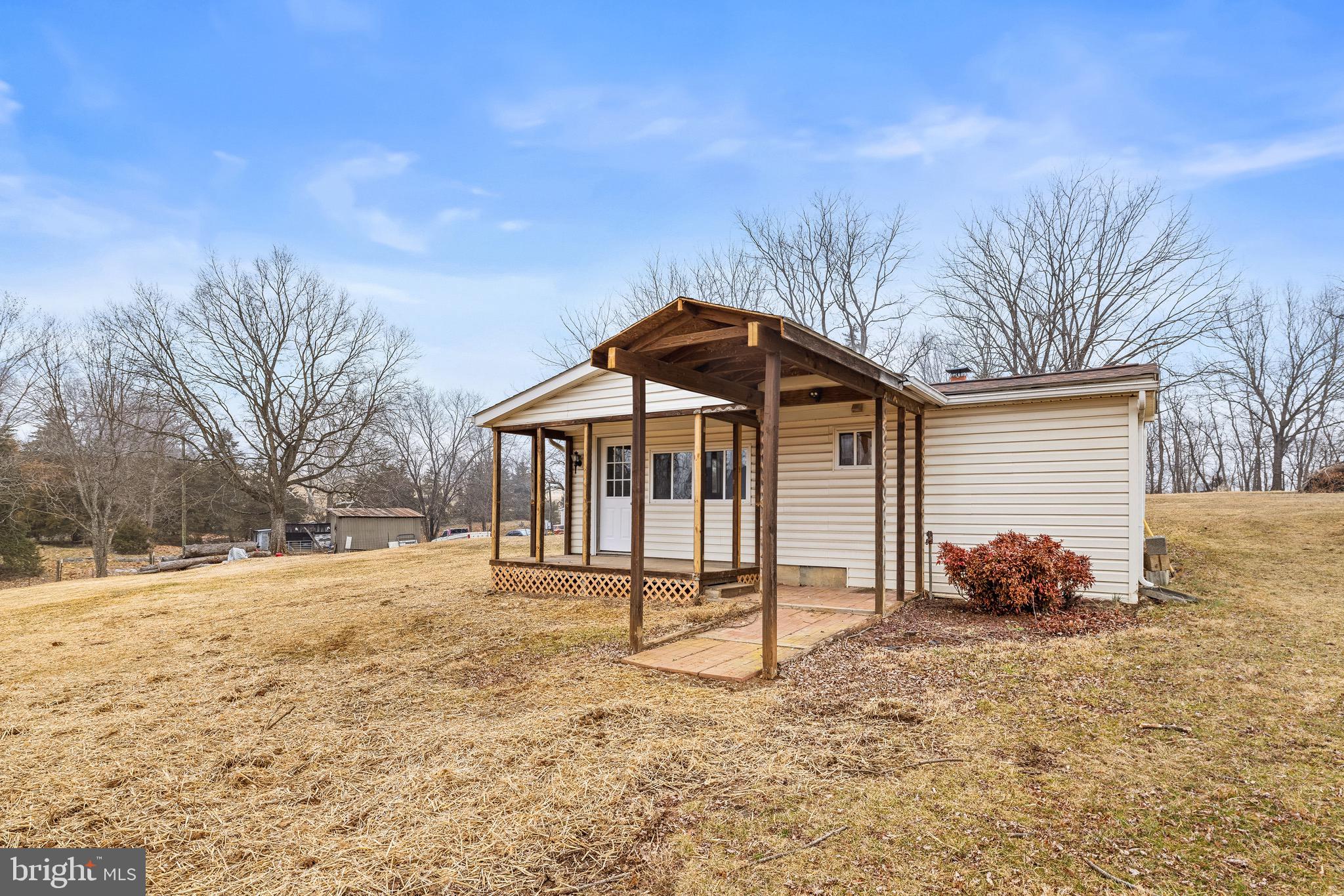 3360 Senedo Road Quicksburg, VA 22847 - Photo 36 of 58 a blue bench sitting in middle of a yard