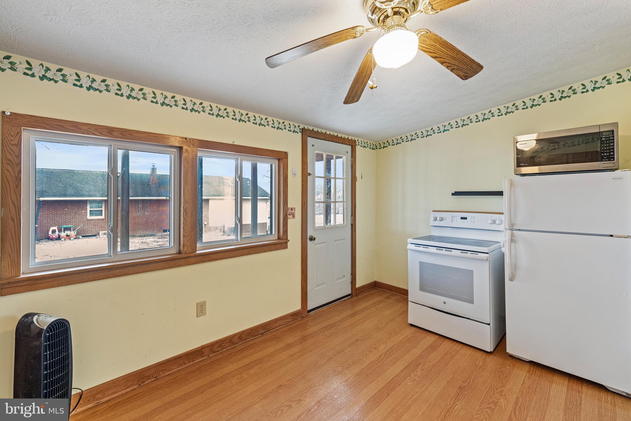 3360 Senedo Road Quicksburg, VA 22847 - Photo 39 of 58 a kitchen with stainless steel appliances granite countertop a stove and a refrigerator