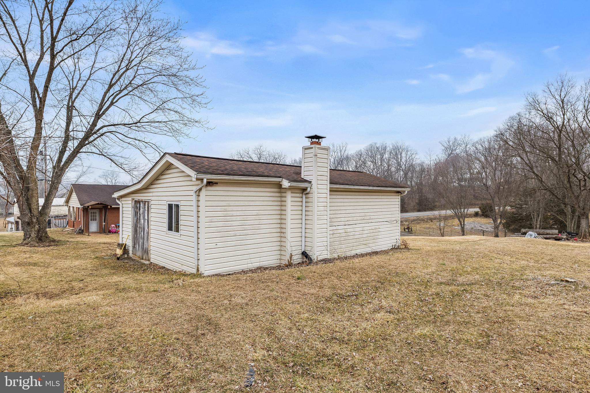 3360 Senedo Road Quicksburg, VA 22847 - Photo 49 of 58 a view of a house with a yard