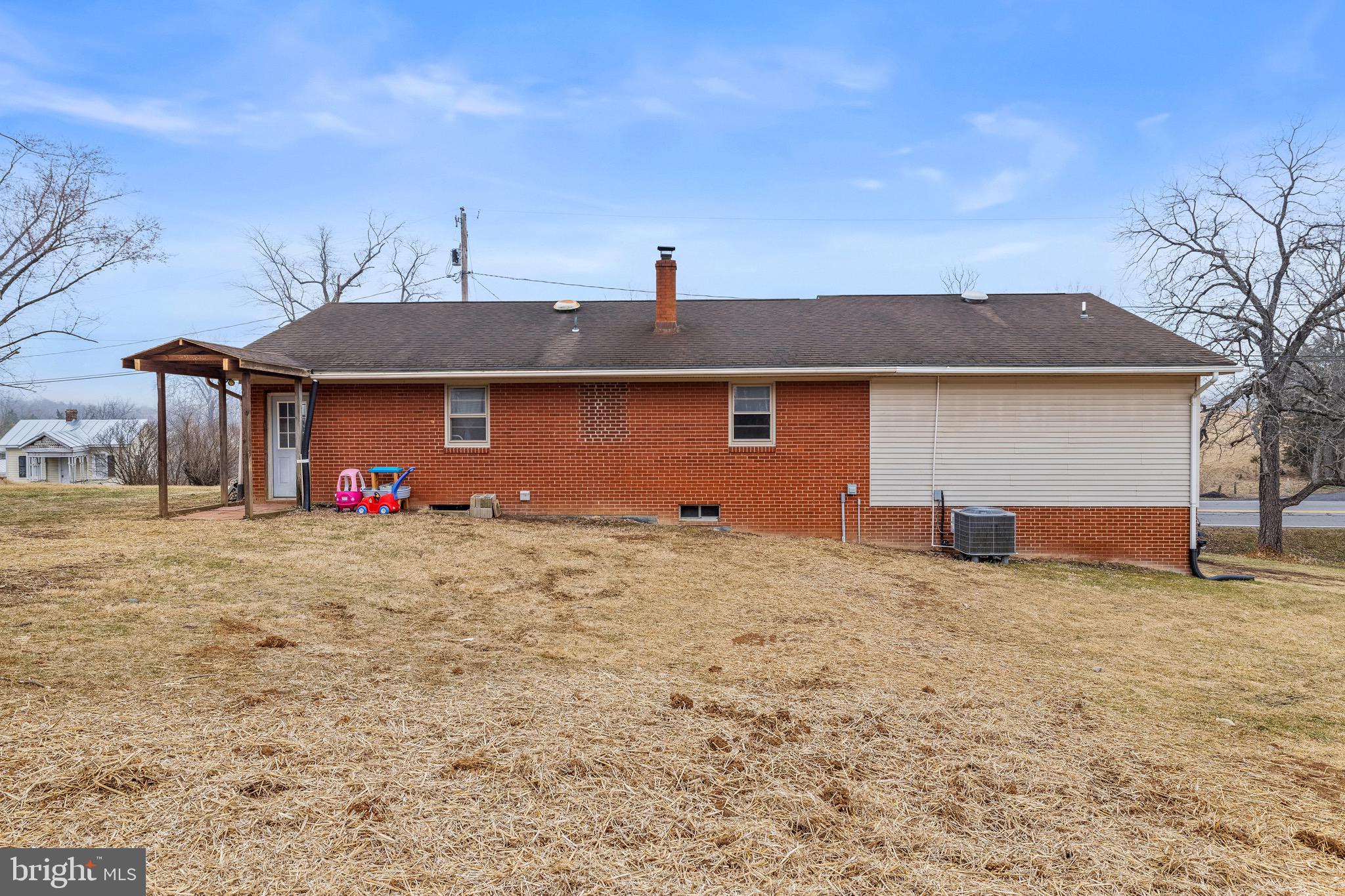 3360 Senedo Road Quicksburg, VA 22847 - Photo 55 of 58 a front view of a house with a yard and garage