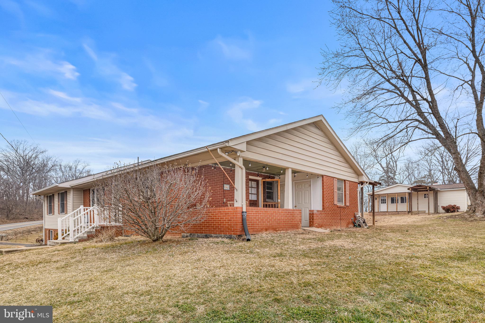 3360 Senedo Road Quicksburg, VA 22847 - Photo 58 of 58 a backyard of a house with large trees and windows