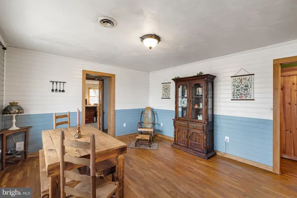a view of a livingroom with furniture window and wooden floor
